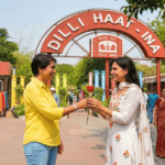 Harry welcomes Maya with a red rose outside Dilli Haat INA metro station one of the most romantic places to visit in Delhi for couples, shopping and regional food.