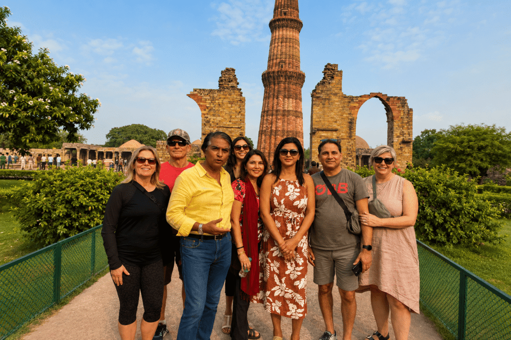 Qutub Minar Tour Guide: Private Entrance Tour & History | Go With Harry 7 Qutub minar tour guide is with Canadian tourists having great time