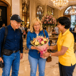 New Delhi Guided Tour: Explore Delhi in Comfort with a Local Expert New Delhi Guided Tour: Best Half Day Delhi Experience with a Local Guide meeting an international tourist at hotel lobby with flowers