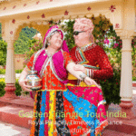 International tourists Sarah and Brad enjoying traditional Rajasthani dress during the Golden Triangle Tour India with Delhi, Agra and Jaipur sightseeing experience guided by Private tour guide Harry.