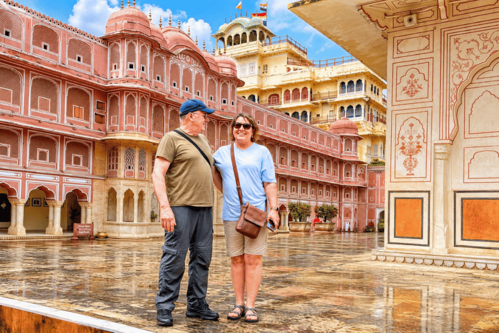 Sarah and Brad exploring royal palaces of City Palace Jaipur in the rains feeling romantic at there Golden Triangle Tour India with Harry