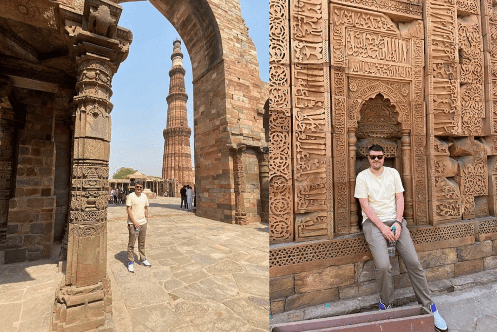 A solo tourist marveling at the intricately carved historic tower of Qutub Minar during a guided tour in Delhi