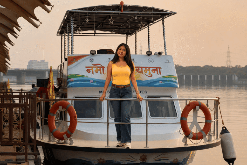 Delhi's Namo Yamuna River Cruise Guide – Ticket Timing & Nearest Metro 2 Delhi Yamuna River Cruise – Best Guide for Delhi’s Yamuna River Cruise – a young girl is taking her selfie with Yamuna cruise