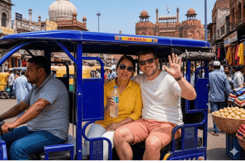 Solo traveler David and trusted Delhi tour guide Harry (in yellow kurta) sharing a joyful laugh while riding in an auto-rickshaw (Tuk Tuk) through the lively streets of Delhi, India
