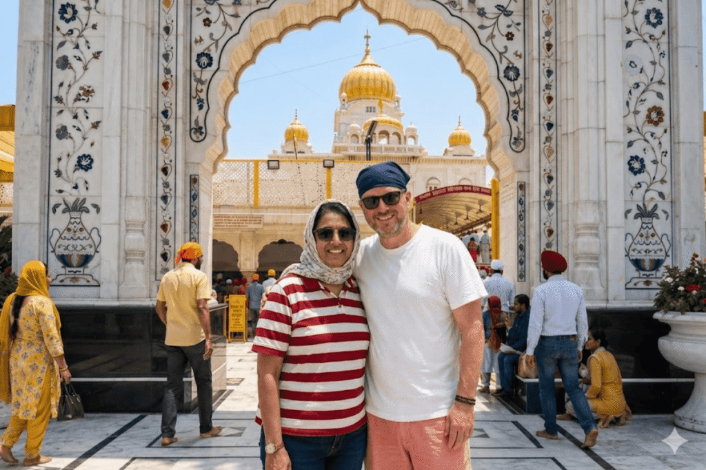 International tourist David with head covered experiencing the spiritual reflection pool at Gurudwara Bangla Sahib with private Delhi tour guide Harry