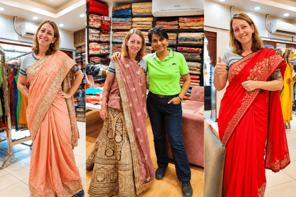 International visitor trying traditional Indian sarees during a private Delhi Shopping Tour.