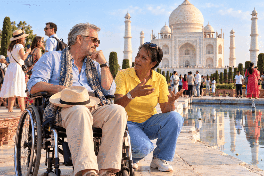 "Harry, a licensed tour guide in a yellow shirt and blue jeans, kneeling to converse with a male traveler in a wheelchair, with the majestic Taj Mahal and its reflecting pool in the background."   